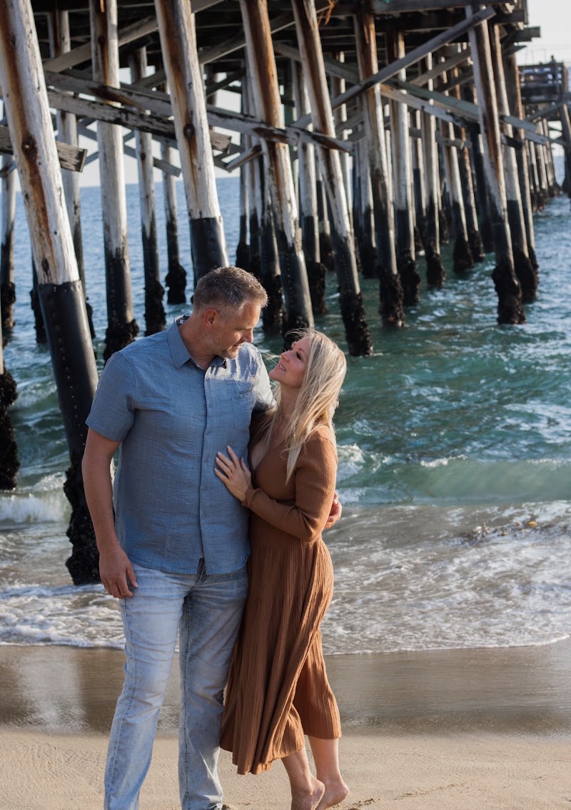 Brent and Jamie together under a beach pier
